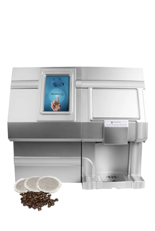 A modern coffee pod machine with a digital touchscreen display, coffee pods, and coffee beans arranged in front of the unit.